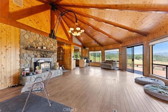 125 Cedar Gulch Rd, Hayfork, CA 96041 - living room with wood ceiling with exposed beams, hardwood / wood-style flooring, a chandelier, high vaulted ceiling, and a fireplace