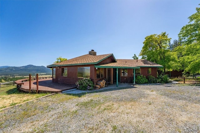 125 Cedar Gulch Rd, Hayfork, CA 96041 - rear view of property with a chimney and a mountain view