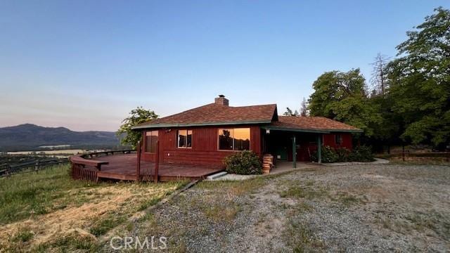 125 Cedar Gulch Rd, Hayfork, CA 96041 - view of front of home with a wooden deck and a chimney