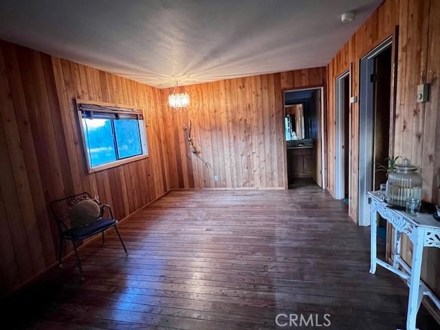 125 Cedar Gulch Rd, Hayfork, CA 96041 - unfurnished room with hardwood / wood-style floors and wooden walls