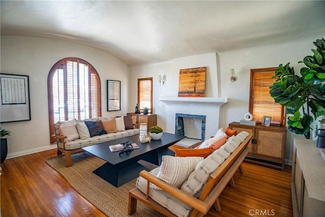 2691 Golden Ave, Long Beach, CA 90806 - living area with baseboards, lofted ceiling, a fireplace, and wood finished floors