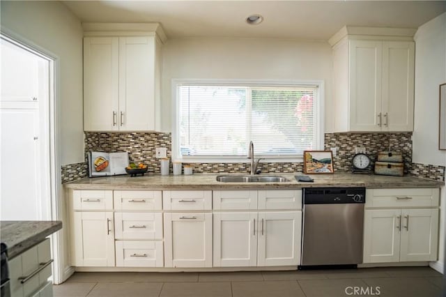 2691 Golden Ave, Long Beach, CA 90806 - kitchen featuring dishwasher, a sink, light tile patterned flooring, and white cabinetry