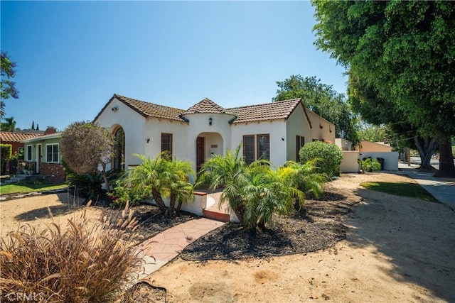 2691 Golden Ave, Long Beach, CA 90806 - mediterranean / spanish house with a tiled roof and stucco siding