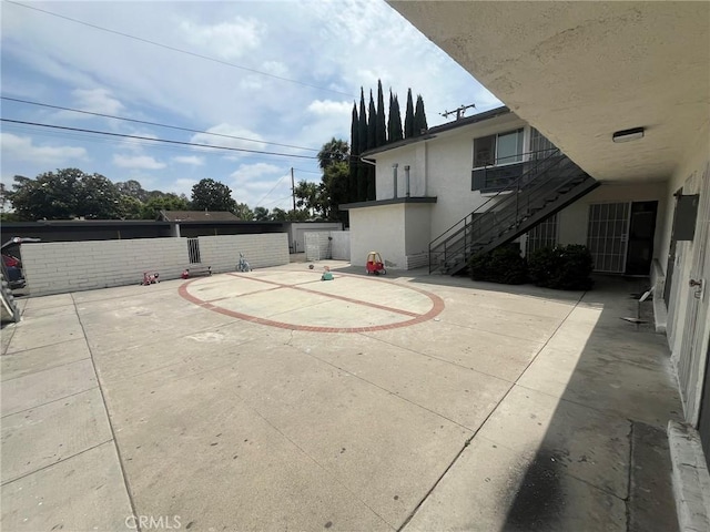 12905 Palm St, Garden Grove, CA 92840 - view of patio featuring basketball court and stairs