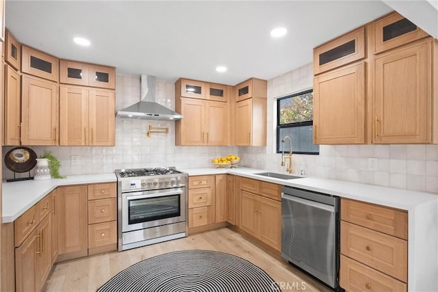 2220 Halladay St, Santa Ana, CA 92707 - kitchen featuring stainless steel appliances, wall chimney exhaust hood, a sink, decorative backsplash, and recessed lighting