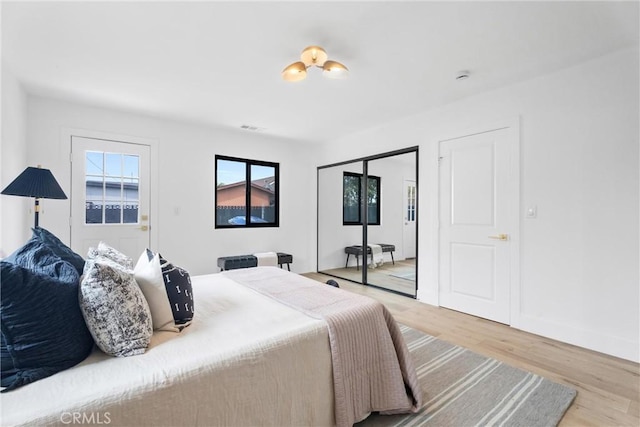 2220 Halladay St, Santa Ana, CA 92707 - bedroom with light wood-style floors, a closet, and baseboards