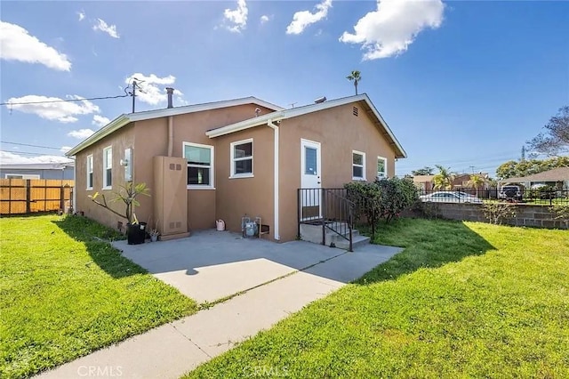 11304 Oklahoma Ave, South Gate, CA 90280 - rear view of house with stucco siding and a patio area