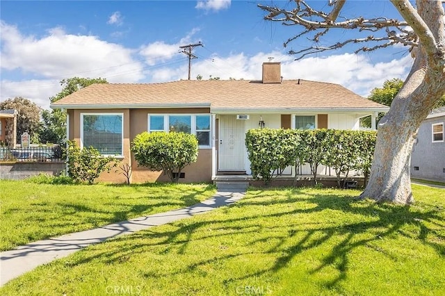 11304 Oklahoma Ave, South Gate, CA 90280 - view of front of property with a chimney and a front yard