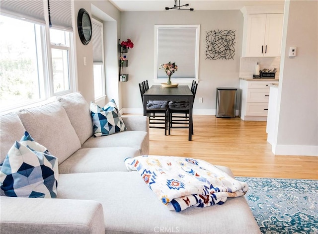 11304 Oklahoma Ave, South Gate, CA 90280 - living area featuring light wood-style floors and baseboards