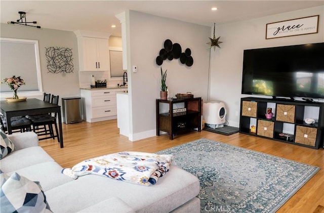 11304 Oklahoma Ave, South Gate, CA 90280 - living area featuring recessed lighting, light wood-type flooring, and baseboards