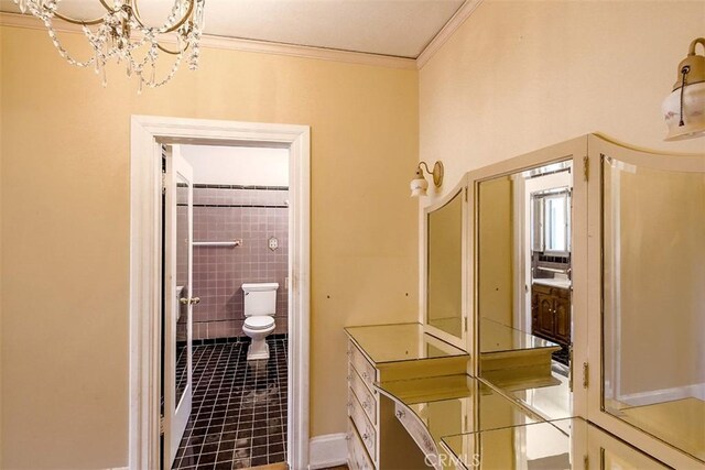 101 S Windsor Blvd, Los Angeles, CA 90004 - bathroom featuring crown molding, a chandelier, tile patterned flooring, and toilet