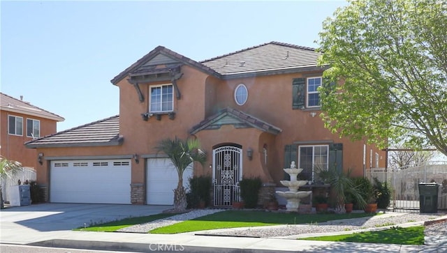 15541 Bow String St, Victorville, CA 92394 - view of front facade with concrete driveway, a tiled roof, stucco siding, and an attached garage