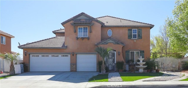 15541 Bow String St, Victorville, CA 92394 - view of front facade featuring a tile roof, driveway, and stucco siding