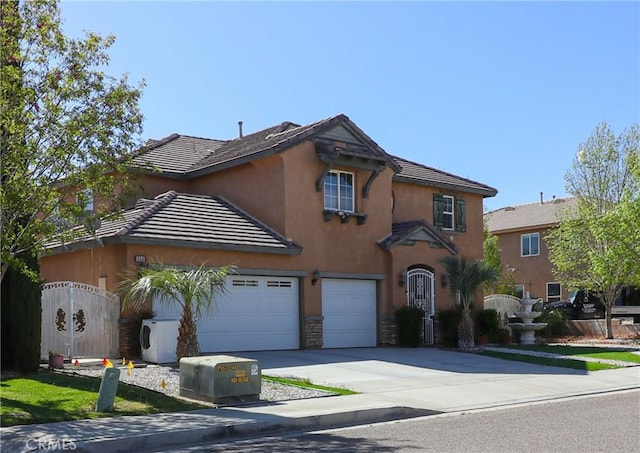 15541 Bow String St, Victorville, CA 92394 - view of front of property with driveway, stucco siding, stone siding, and a cooling unit