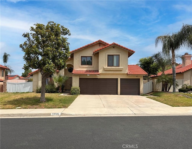 23790 Redbark Dr, Moreno Valley, CA 92557 - mediterranean / spanish-style home with a tile roof, a garage, driveway, and stucco siding