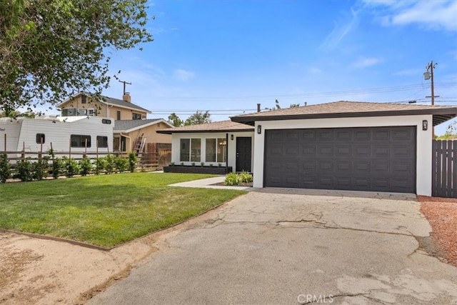 45433 Lorimer Ave, Lancaster, CA 93534 - view of front facade featuring stucco siding, an attached garage, and driveway