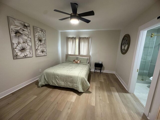 2453 Curlew St, San Diego, CA 92101 - bedroom with wood finished floors, baseboards, connected bathroom, and a ceiling fan
