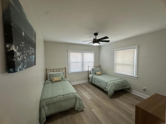 2453 Curlew St, San Diego, CA 92101 - bedroom with wood finished floors, baseboards, and ceiling fan