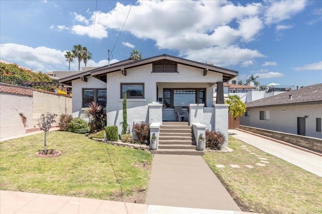 2453 Curlew St, San Diego, CA 92101 - view of front of house with stucco siding, a front yard, and a porch