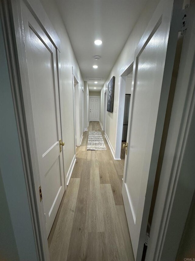 2453 Curlew St, San Diego, CA 92101 - hallway with recessed lighting, wood finished floors, and baseboards
