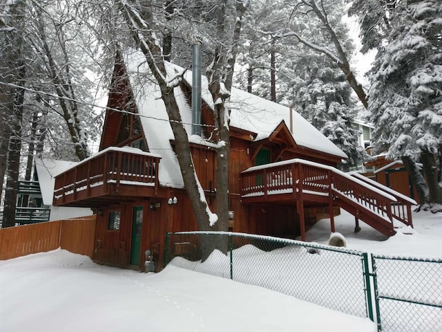 31450 Oceanview Dr, Running Springs, CA 92382 - snow covered house featuring a wooden deck