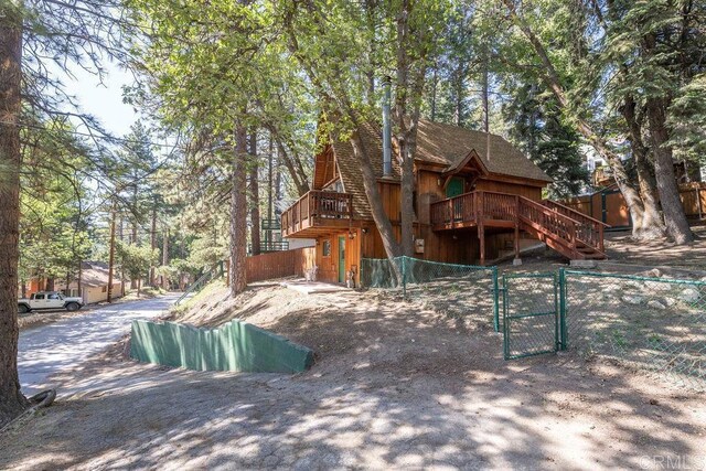 31450 Oceanview Dr, Running Springs, CA 92382 - view of side of property featuring a gate and a chimney