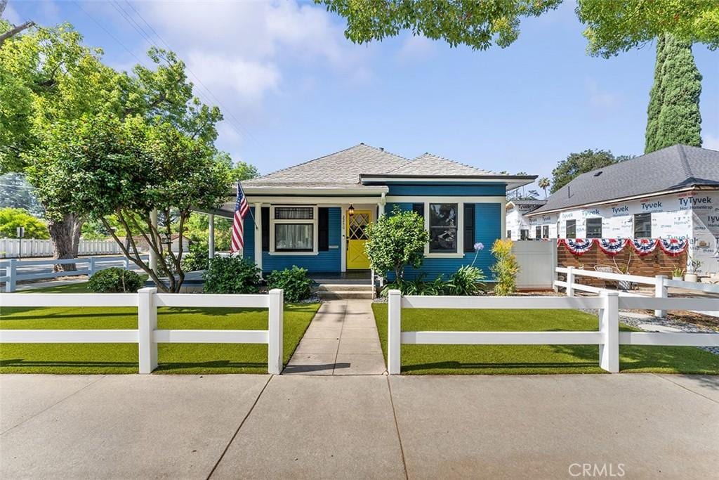 2280 Bonita Ave, La Verne, CA 91750 - bungalow-style home with a porch, a fenced front yard, and roof with shingles