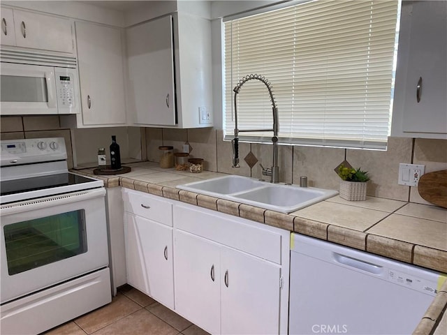 54858 Martinez Trl, Yucca Valley, CA 92284 - kitchen featuring white appliances, backsplash, white cabinets, and light countertops