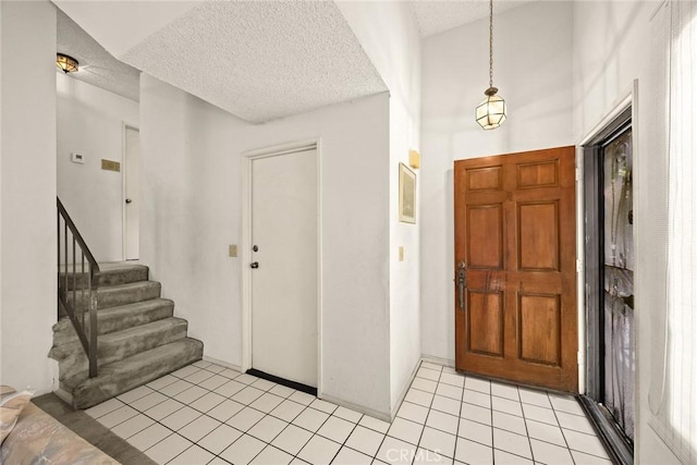 422 S Alhambra Ave Unit A, Monterey Park, CA 91755 - entryway with a textured ceiling, stairs, and light tile patterned floors