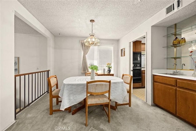 422 S Alhambra Ave Unit A, Monterey Park, CA 91755 - dining room with light colored carpet, a textured ceiling, bar area, and a chandelier