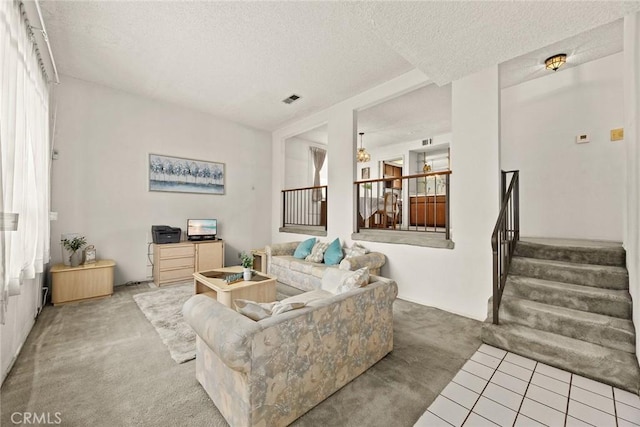 422 S Alhambra Ave Unit A, Monterey Park, CA 91755 - carpeted living area featuring stairway, plenty of natural light, a textured ceiling, and tile patterned floors