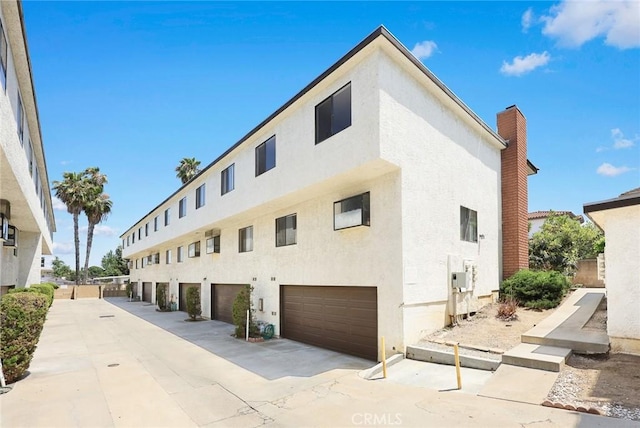 422 S Alhambra Ave Unit A, Monterey Park, CA 91755 - view of building exterior with a garage and driveway