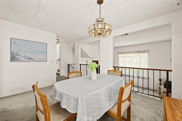 422 S Alhambra Ave Unit A, Monterey Park, CA 91755 - dining space featuring carpet flooring, a chandelier, and a textured ceiling