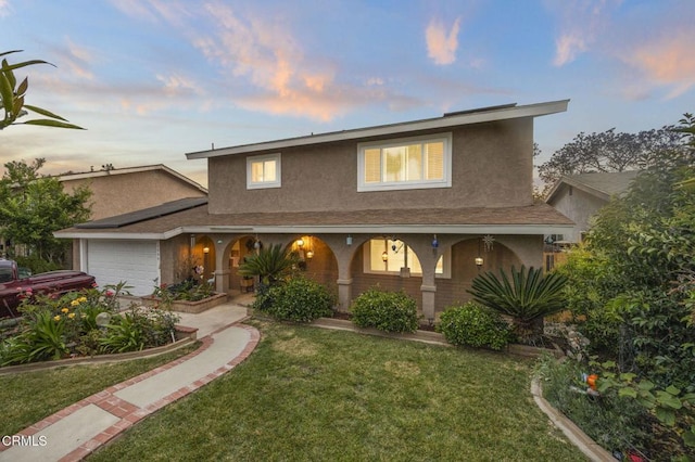 1099 N Agusta Ave, Camarillo, CA 93010 - traditional-style home with stucco siding, covered porch, a garage, and a yard
