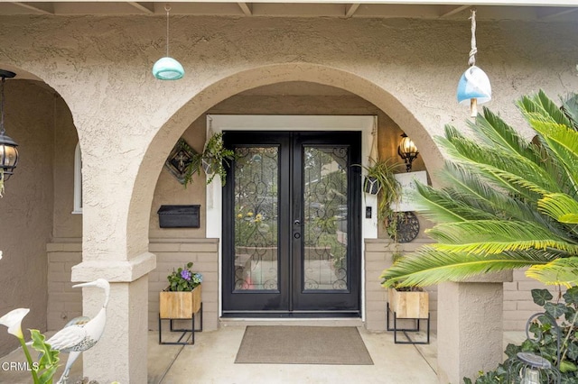 1099 N Agusta Ave, Camarillo, CA 93010 - view of exterior entry featuring french doors and stucco siding