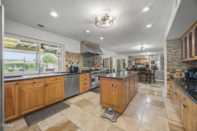 1099 N Agusta Ave, Camarillo, CA 93010 - kitchen featuring stainless steel appliances, island range hood, a kitchen island, decorative backsplash, and recessed lighting