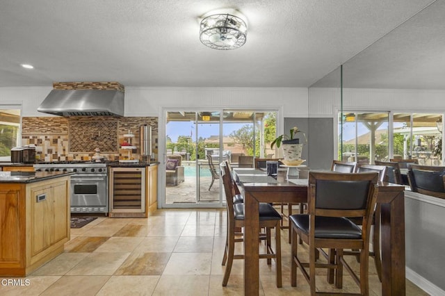1099 N Agusta Ave, Camarillo, CA 93010 - dining area with wine cooler and a textured ceiling