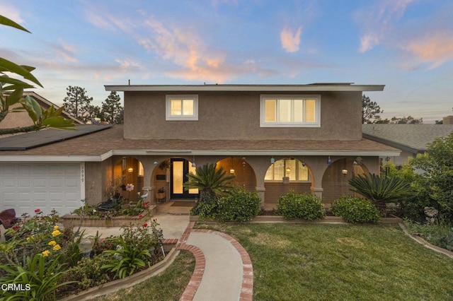 1099 N Agusta Ave, Camarillo, CA 93010 - traditional home with stucco siding, a garage, a porch, and a front lawn