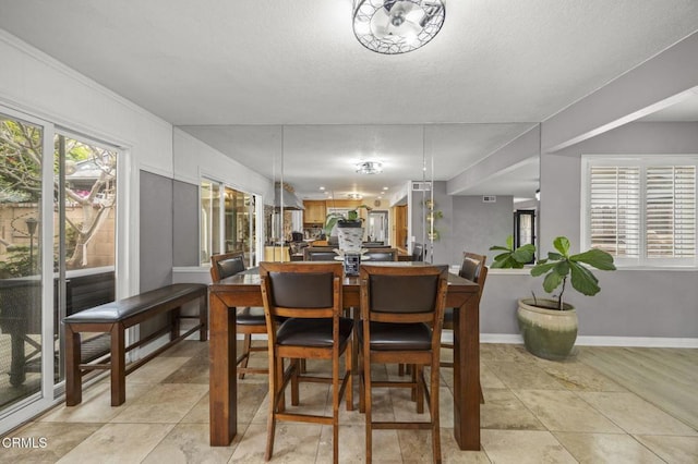 1099 N Agusta Ave, Camarillo, CA 93010 - dining room featuring baseboards and a textured ceiling