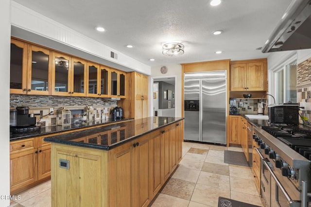 1099 N Agusta Ave, Camarillo, CA 93010 - kitchen featuring stainless steel built in refrigerator, extractor fan, a kitchen island, backsplash, and recessed lighting