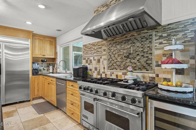 1099 N Agusta Ave, Camarillo, CA 93010 - kitchen with high quality appliances, range hood, wine cooler, decorative backsplash, and recessed lighting