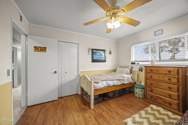 1099 N Agusta Ave, Camarillo, CA 93010 - bedroom with wood finished floors, crown molding, a closet, and a ceiling fan