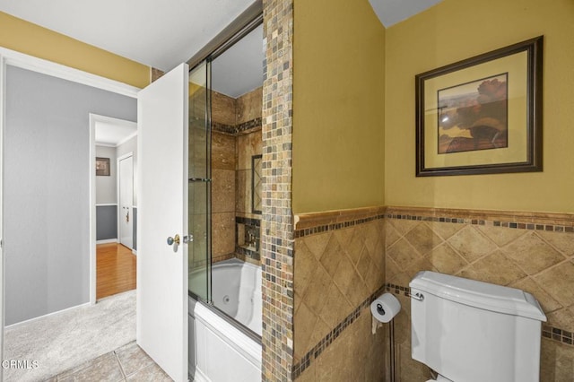 1099 N Agusta Ave, Camarillo, CA 93010 - full bathroom featuring a combined bath / shower with jetted tub, tile walls, tile patterned floors, and wainscoting
