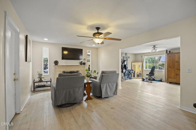 1099 N Agusta Ave, Camarillo, CA 93010 - living area with a ceiling fan, a fireplace, light wood finished floors, and recessed lighting