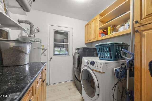 1099 N Agusta Ave, Camarillo, CA 93010 - washroom with washer and dryer, light wood-type flooring, cabinet space, and secured water heater