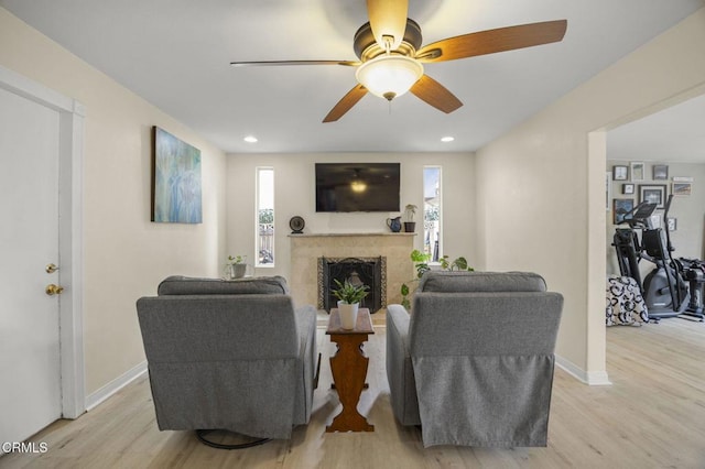 1099 N Agusta Ave, Camarillo, CA 93010 - living room featuring light wood finished floors, a fireplace, ceiling fan, and recessed lighting