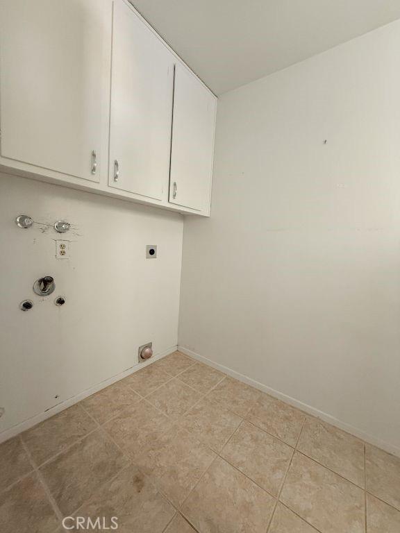 25620 Cherry Hills Blvd, Menifee, CA 92586 - laundry room featuring hookup for an electric dryer, cabinet space, gas dryer hookup, washer hookup, and baseboards