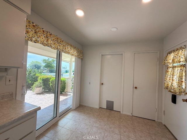 25620 Cherry Hills Blvd, Menifee, CA 92586 - unfurnished dining area with light tile patterned flooring, recessed lighting, and baseboards