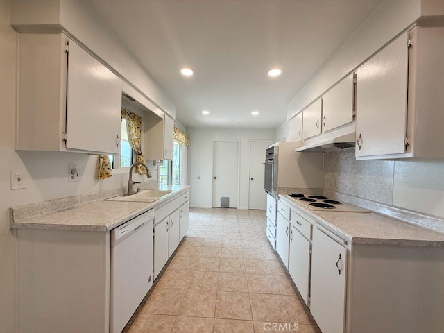25620 Cherry Hills Blvd, Menifee, CA 92586 - kitchen with white appliances, a sink, under cabinet range hood, tasteful backsplash, and light countertops