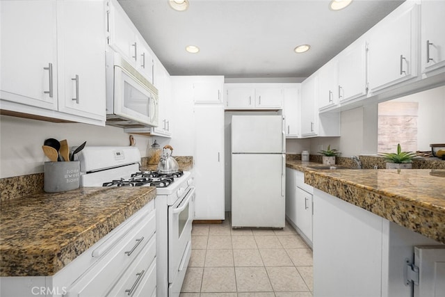 3721 Country Club Dr Unit 18, Long Beach, CA 90807 - kitchen featuring white appliances, white cabinetry, recessed lighting, light tile patterned flooring, and dark countertops